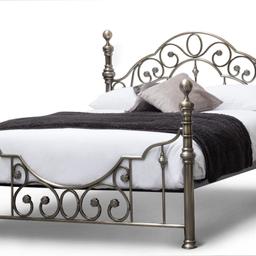The Canterbury is a beautiful Victorian Antiqued style bed, that has a traditional frame with a romantic twist. Its smooth sophisticated brass effect bed frame features intricate detailing, that combines a classic vintage look with romantic character to create a truly unique bed that will look stunning in your bedroom. The footboard has an unusual deep dipped curve, in contrast the headboard curves upwards. Both are complete with swirled framing and flower detailing.

Can deliver for fuel