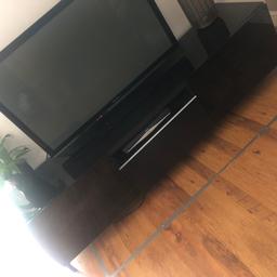 Dark brown glass Ikea tv init. In good condition apart from slight bow in the middle as shown in last pic hence low asking price. Originally purchased for £200. Can deliver locally for fuel cost