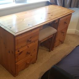 Solid Real Oak dressing table, comes with stool. In overall good condition but does have starches on top service which can be sorted with a fresh stain.