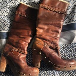 Knee high , leather ugg boots , fully lined worn a hand full of times ... says size 7.5 but they more like a 6