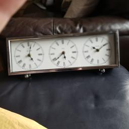 lovely chome clock. times for  new York. England and parris. battery operated.