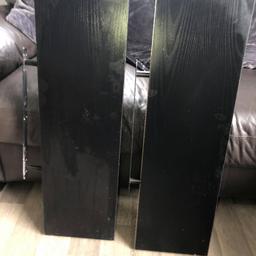 2 black floating shelves with brackets