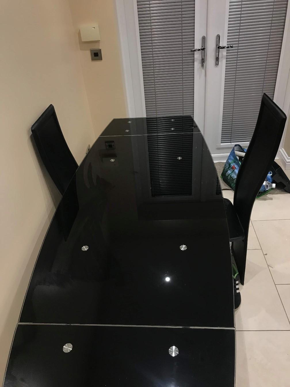 Harveys 6 chair black glass dining table in NE23 Hartford for £150.00
