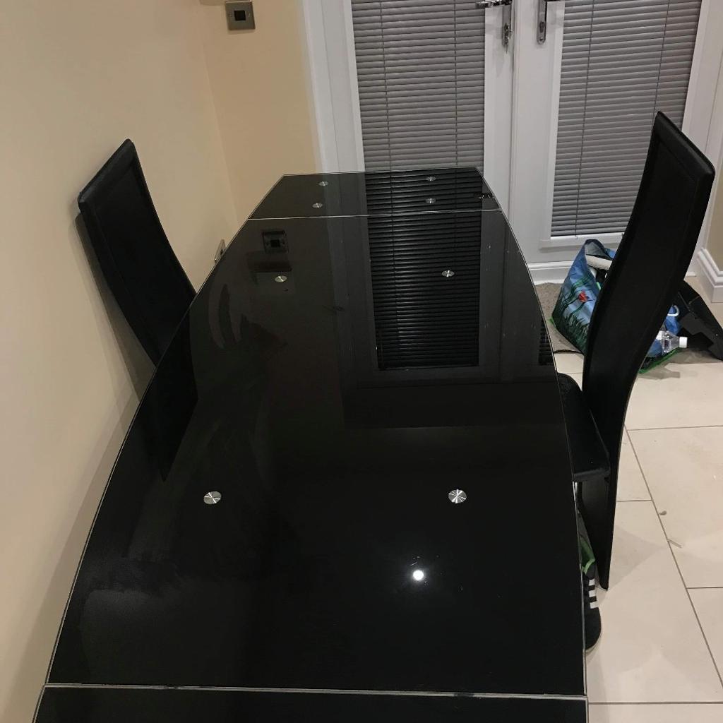 Harveys 6 chair black glass dining table in NE23 Hartford for £150.00