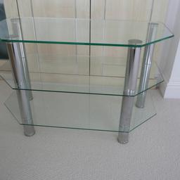 Glass TV Stand. Three glass shelves on chrome legs. Size 80 cm long x 40 deep x 50 high. Buyer collects.