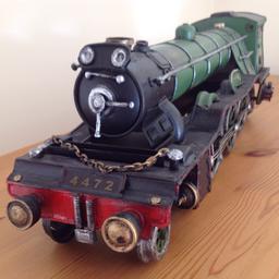 Beautiful ornamental metal train. Dimensions - length 65 cms, width 12 cms, height 14 cms. Bought from a craft shop as a gift and is still in the same good as new condition.