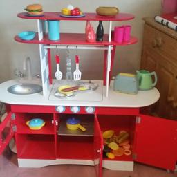 a solid wooden play kitchen excellent condition all complete with food for hrs of fun