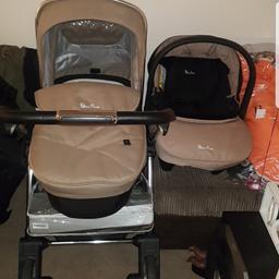 can come with hood fur and fur hand muffs. carseat normal seat and carry cot good condition