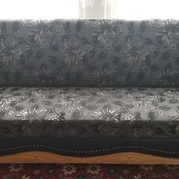 sofa bed colour:black flower patter. damage on hand rest or generally  ok.