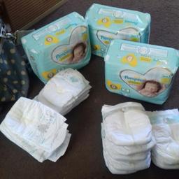 3 packs of size 0 nappies un opened with 14 loose size 0 an 7 loose size 1 and 5 loose size
2