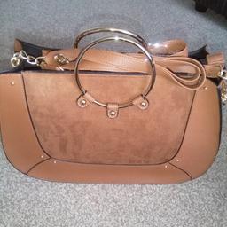 lovely brand new handbag with tags, tan colour, part faux suede on front, purchased for gifts but now not needed. bargain price as were £12 (as photo shows). Cash on pick up only please.
