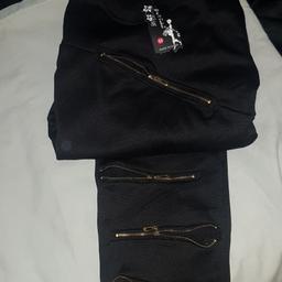 brand new with tags size medium women's black tracksuit with zips on that open
