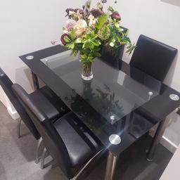 beautiful black glass table with 4 chairs collection from derker Oldham brilliant condition