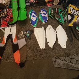 KXF 250/500 2014 plastics, 2x all most complete sets, but make a good set of practise plastics,also motor cross clothes, sinisalo trousers waist 32, in very good condition still, 2x tops, 1x starz top ( red/black one) size large in good condition, o-noel top (yellow and black) in size xxl, has a few oily stains on it, but still in good condition, all this would suit someone starting out on motor cross, collection only somercotes de554tj,or willing to post if you cover postage costs, no time wast