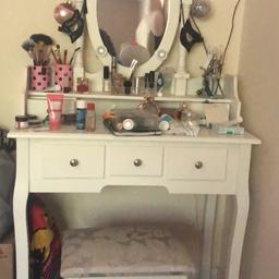 Make up table, great quality, three drawers, a stool and lights around the mirror. Small damages under mirror but invisible when you have make up and other stuff on. Selling as moving