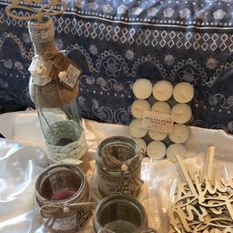 Centre piece decorations
4 glass bottles
4 different sized glass jars
Hand made
Wooden table numbers
Candles

Collection only.