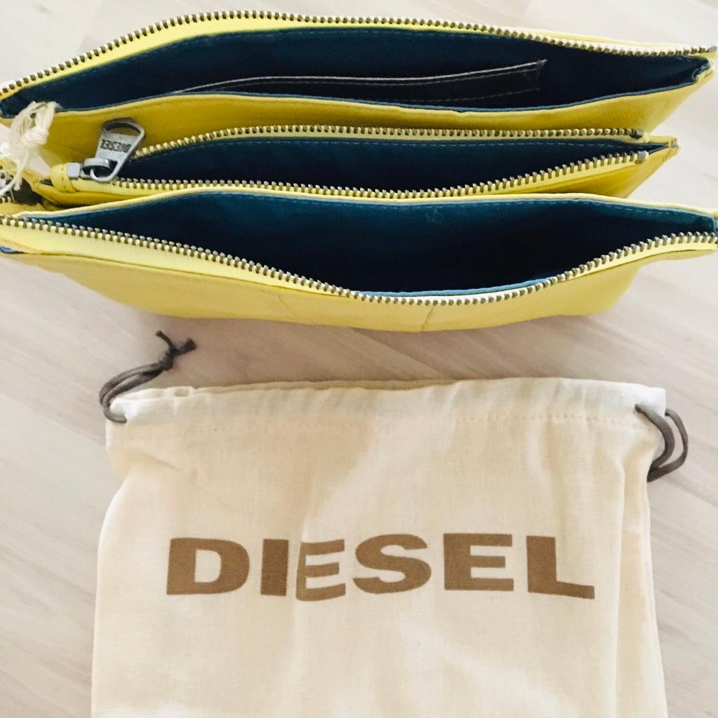 Clutch von Diesel, NEU
Leder, gelb
mit Stoffbeutel
+ Porto bei Versand