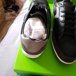 mens size 9 hugo boss trainers, brand new trainers still in box . never been worn in excellent condition.  can be posted out or collected.  navy blue and grey .
