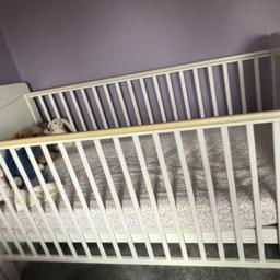 Cot bed with teething tails
