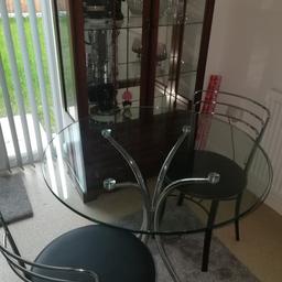 This is a glass dinning table with 2 chrome and leather chair, would be ideal for a small kitchen or a mini flat, perfect condition. Pick up only or local delivery.