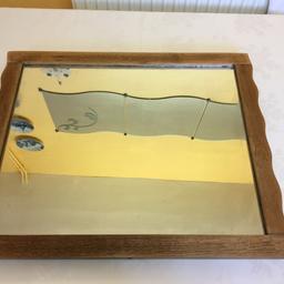 Lovely mirror waxed and with original glass .