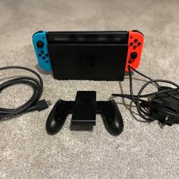 Nintendo Switch Console Neon Red & Blue
Comes with Original docking station, wires and controller. 

Games:
Pokemon: Let’s Go Pikachu
Mario Kart 8 Deluxe
Overcooked 2
Fifa 18

Additional accessorises:
Official Nintendo Switch Carry Case including padded case
Skull & Co Maxcarry Case with game slots, grip case and additional grips.
1x Screen Protector

Excellent condition