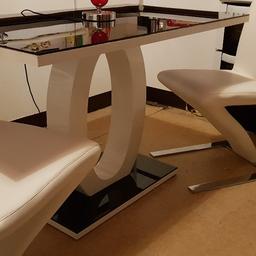 white gloss and black glass dining table some scratches to glass top e everything else fine 2 white/ cream Zed chairs excellent condition 70