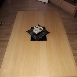 this is very big light oak coffee table it as just a very tiny scratch not that nocible collect in person