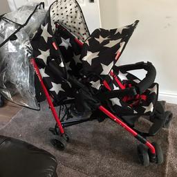 Black with white stars. Is used but still has plenty of life left.
Only selling as my older one is getting too big for it now .
No rips or tears, comes with rain cover. Footmuff for front child and newborn baby cover. As back seat flattens down.

Open to offers.