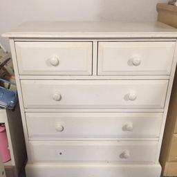 White solid wood. No damage, just cosmetic.