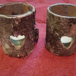 10 rustic wooden candle holders each with glass inside. 
Used once as part of wedding table centre pieces.