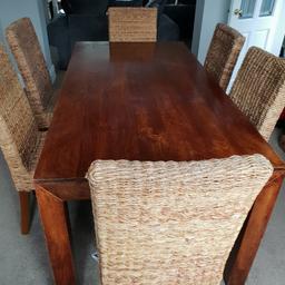 hi I have for sale a dining table and six wicker chairs very sturdy bought from next .