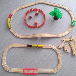big wooden train track with two trains and other bits