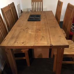 Mexican pine dining table and 8 chairs. Very good condition. Buyer to collect.