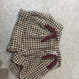 Elasticated waist check shorts with burgundy tie detail. Good condition.