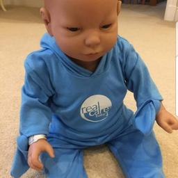 realcare think it over doll male he comes with two sets of clothes nappys and charger has also sencer he's been tested and it's working fine but needs new batterys he comes from smoke free home he's is great condition no marks on him as he's only been used once