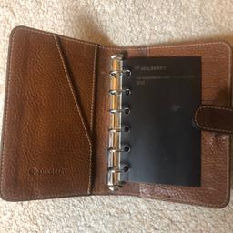 Excellent quality and genuine Mulberry personal organiser. Dark brown colour , still has original mulberry note pages inside, fantastic condition !