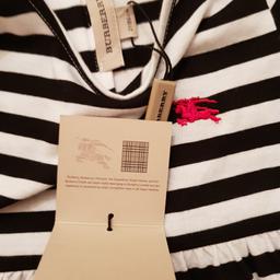 Girls Burberry dress with tags on.
age 2