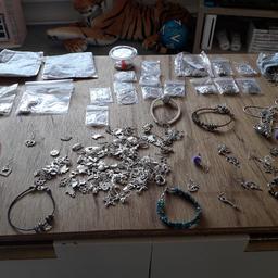 loads of stuff ere to make
earrings     necklace    bracelets 
altogether well over 200 charms
earring hooks are silver plated

theres loads ere couldn't put any more pics on