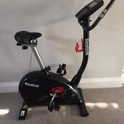 Reebok ONEGB40s exercise bike with user guides