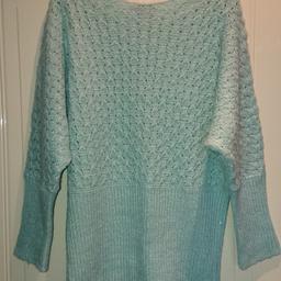 Ladies Jane Norman Aqua Jumper Size 14 see through front and back never been worn. Immaculate condition. Please take a look at my other items for sale as I'm having a big clear out due to expecting a little one.