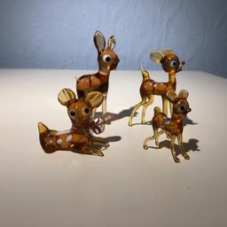 4 small lovely glass deers, one has a bow round his neck. Been on display in a glass cabinet. 

Collection only