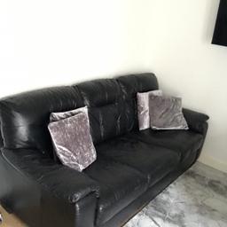 black leather sofa been used but in good condition