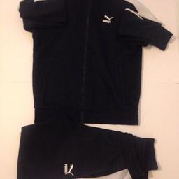 Black Puma tracksuit set. 2 zip up pockets at front, 2 pockets on tracksuit bottom and zip up pocket at the back. Very good condition