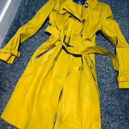 This is a size 12 River Island mustard trench coat absolutely gorgeous quite a rare item this was can post out thank you
