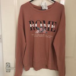 Women/girls jumper size small,the little mark at the top of the jumper is just stitching