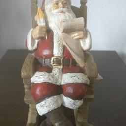 lovely santa on rocking chair bought last year from Clinton's very heavy small imperfection in hand looks lovely needs new home as colour change 20 new so bargain