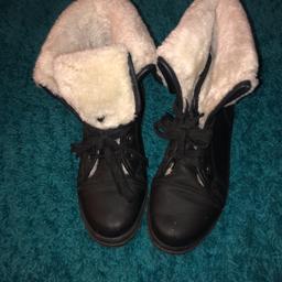 Black ankle boots with white fur 
Good condition 
Size 7