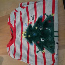 age 4-5. worn once. lovely soft long sleeve christmas tshirt with fluffy xmas tree on the front.