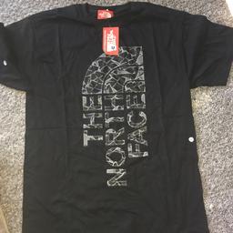 Men’s medium north face T-shirt, with tags in packaging
